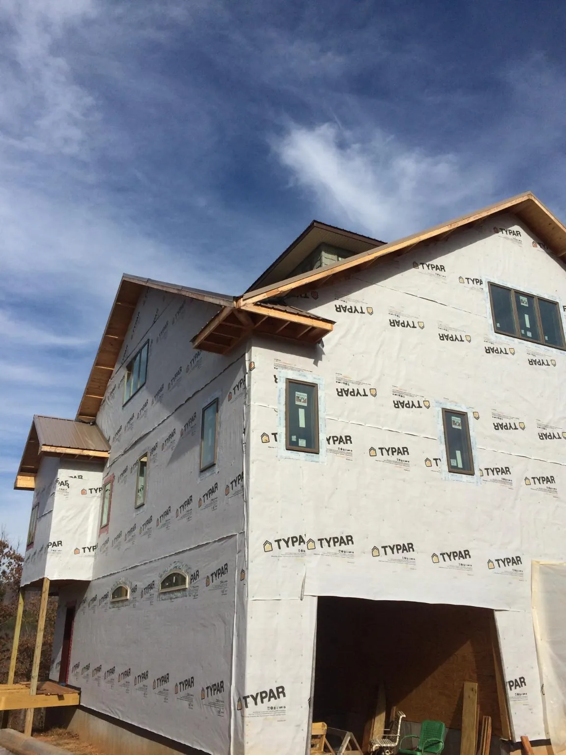 Stick built house wrapped in Typar with new roof framing and dormers in Johnsonburg